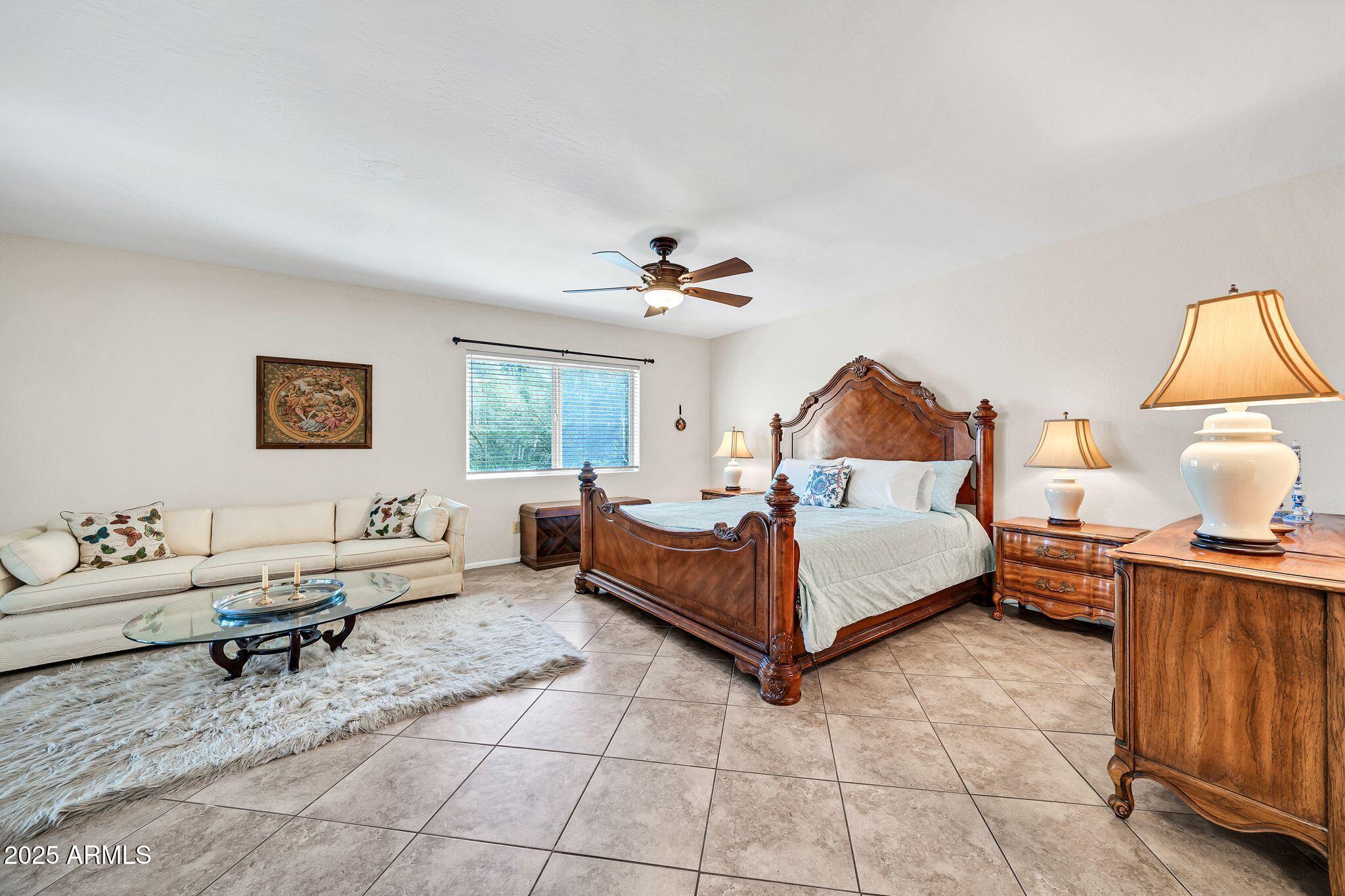 25621 Cordova Lane Rio Verde, AZ 85263 - Photo 22 of 42 a bed room with a bed and a couch