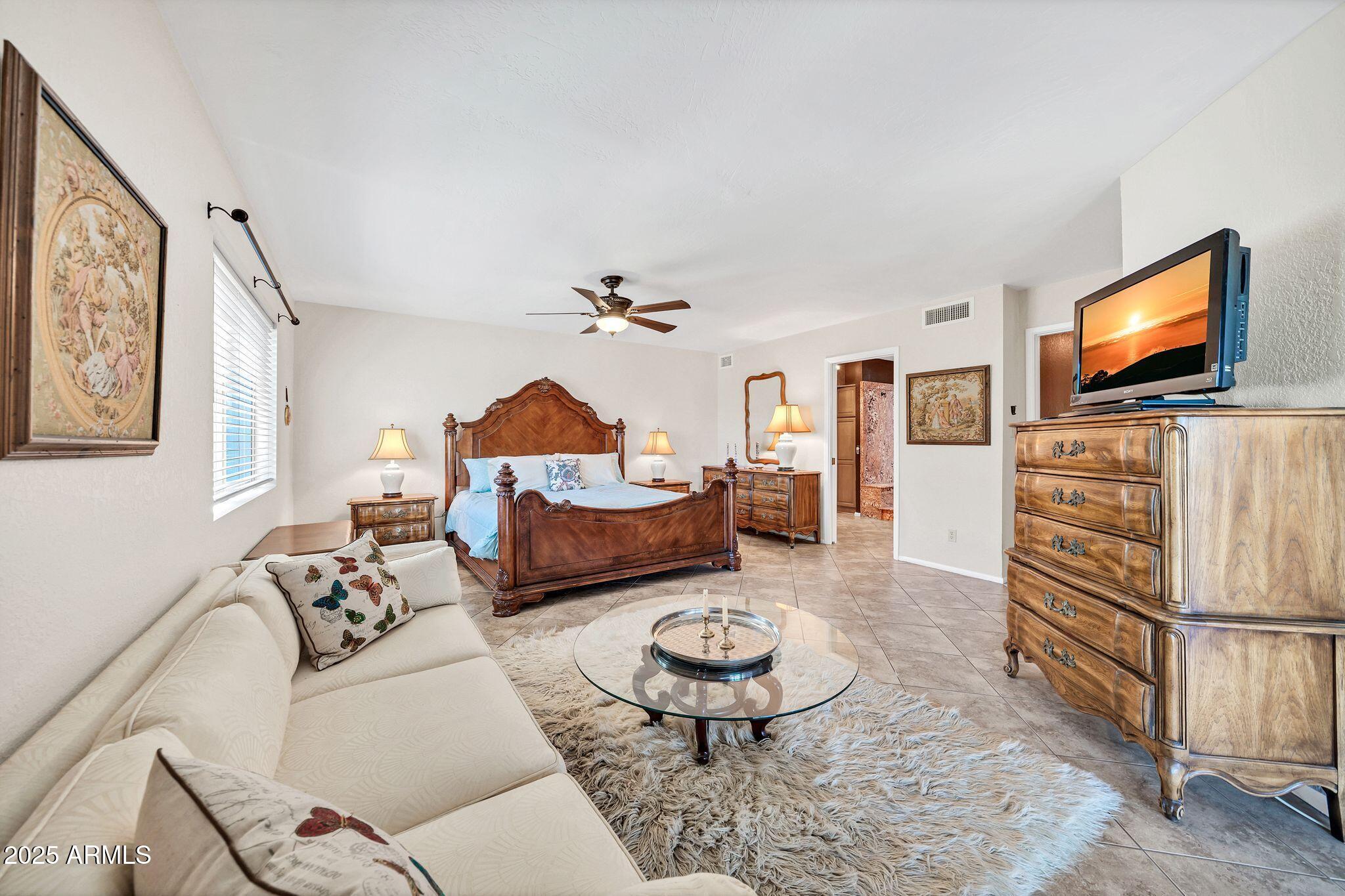 25621 Cordova Lane Rio Verde, AZ 85263 - Photo 23 of 42 a living room with furniture and a flat screen tv