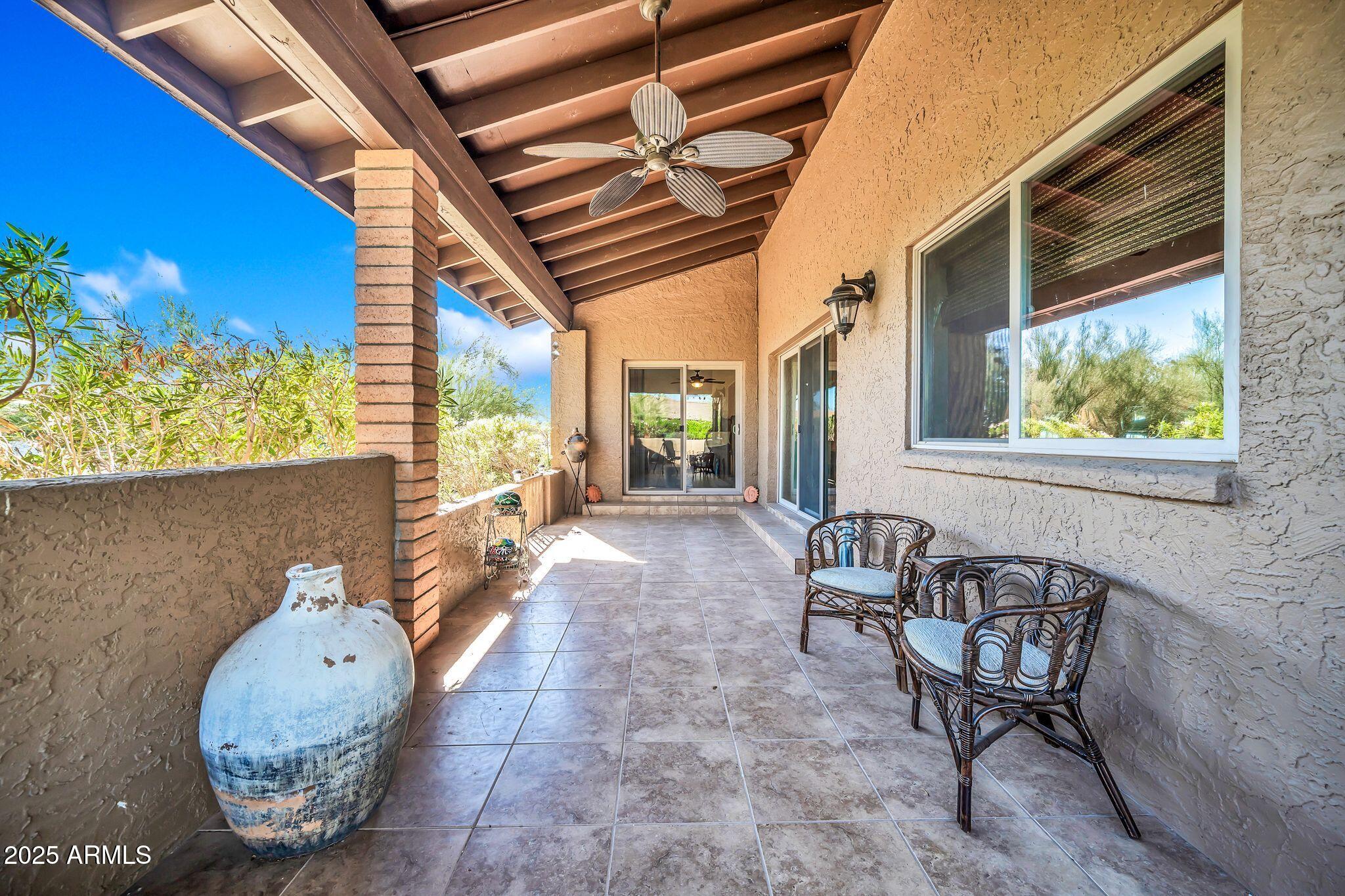 25621 Cordova Lane Rio Verde, AZ 85263 - Photo 41 of 42 a view of an chairs and table in the balcony