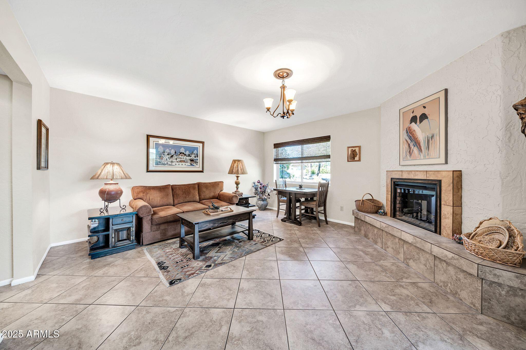 25621 Cordova Lane Rio Verde, AZ 85263 - Photo 7 of 42 a living room with furniture and a fireplace