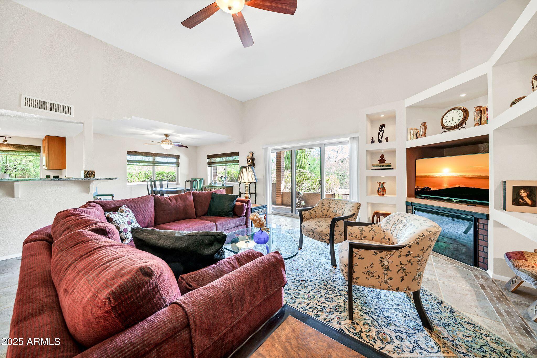 25621 Cordova Lane Rio Verde, AZ 85263 - Photo 10 of 42 a living room with furniture and a flat screen tv