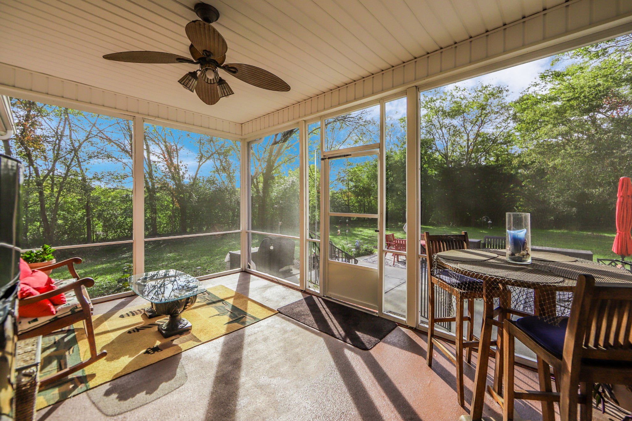 2332 Armstrong Valley Road Murfreesboro, TN 37128 - Photo 40 of 46 a view of a patio with a dining table chairs and a floor to ceiling window