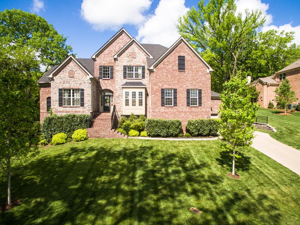 3421 Herbert Drive Franklin, TN 37067 - Photo 1 of 30 a front view of a house with a yard and porch