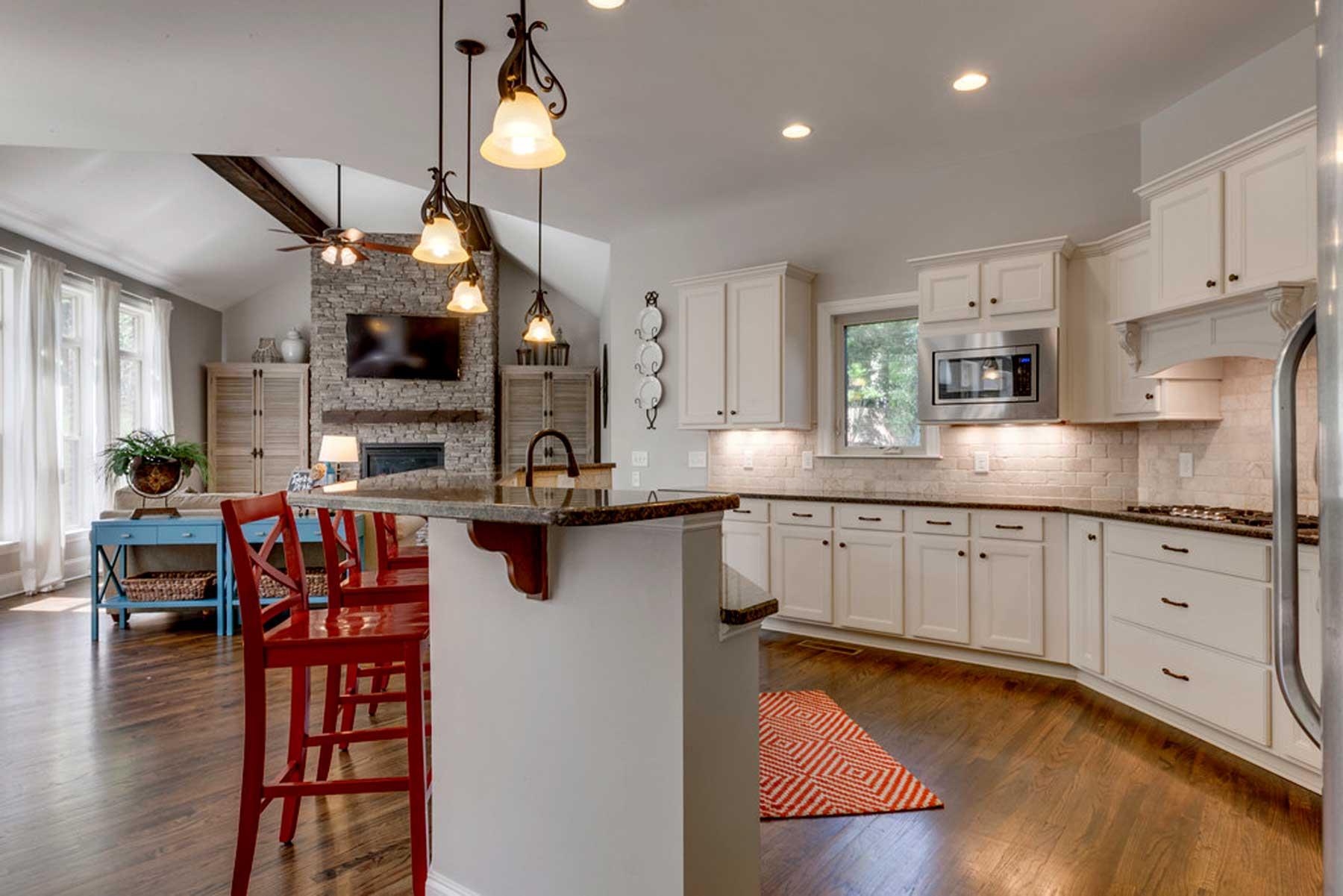 3421 Herbert Drive Franklin, TN 37067 - Photo 15 of 30 a kitchen with stainless steel appliances granite countertop a sink dishwasher a refrigerator and a stove with wooden floor