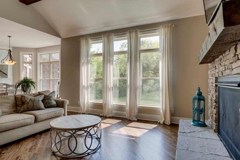 3421 Herbert Drive Franklin, TN 37067 - Photo 21 of 30 a living room with furniture and a fireplace