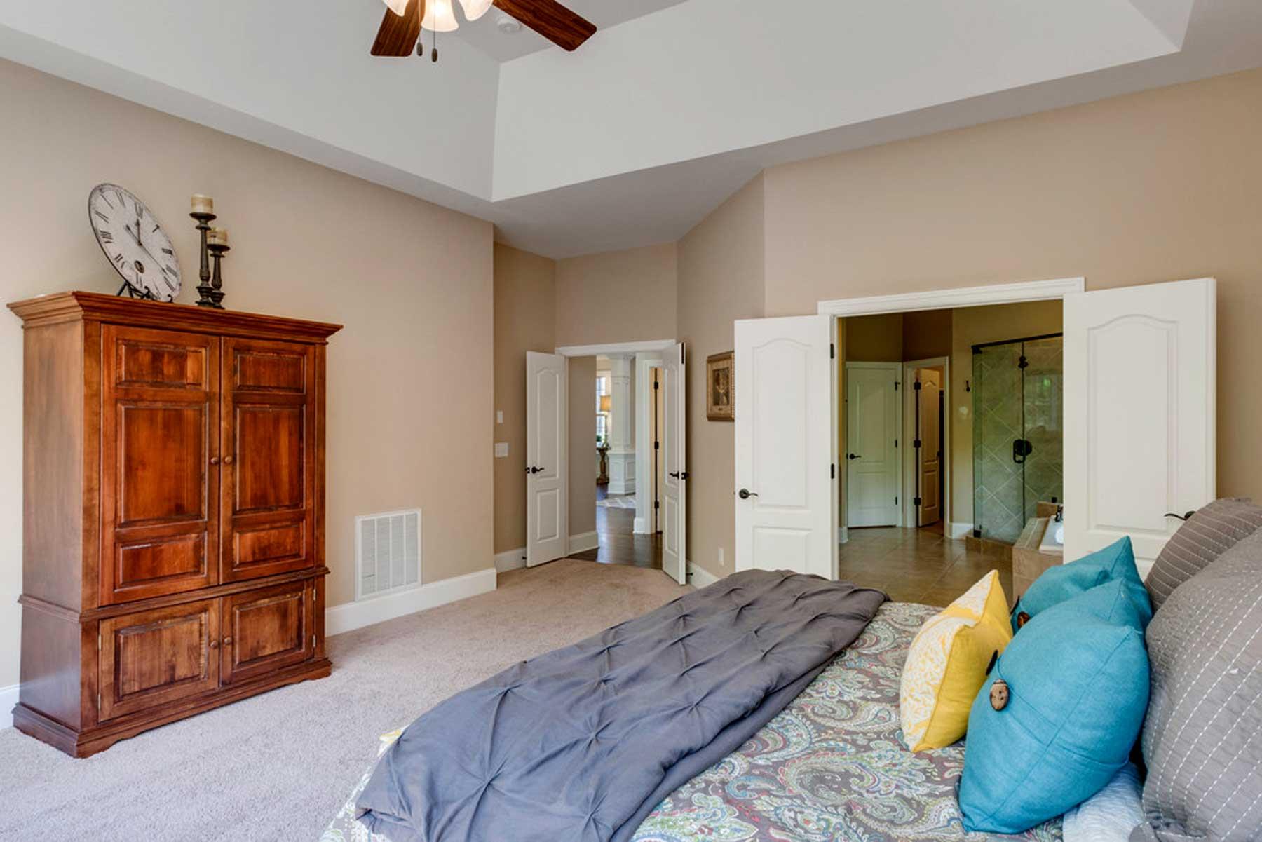 3421 Herbert Drive Franklin, TN 37067 - Photo 24 of 30 a bedroom with a bed and a chandelier