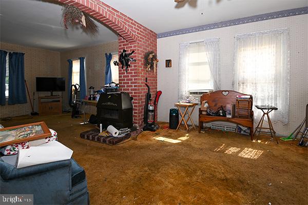 313 Sassafras Street Millville, NJ 08332 - Photo 14 of 25 a living room with furniture a window and gym equipment