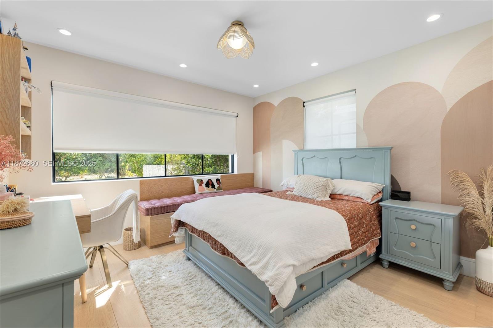 8934 Garland Avenue Surfside, FL 33154 - Photo 12 of 20 a bedroom with a bed and a table