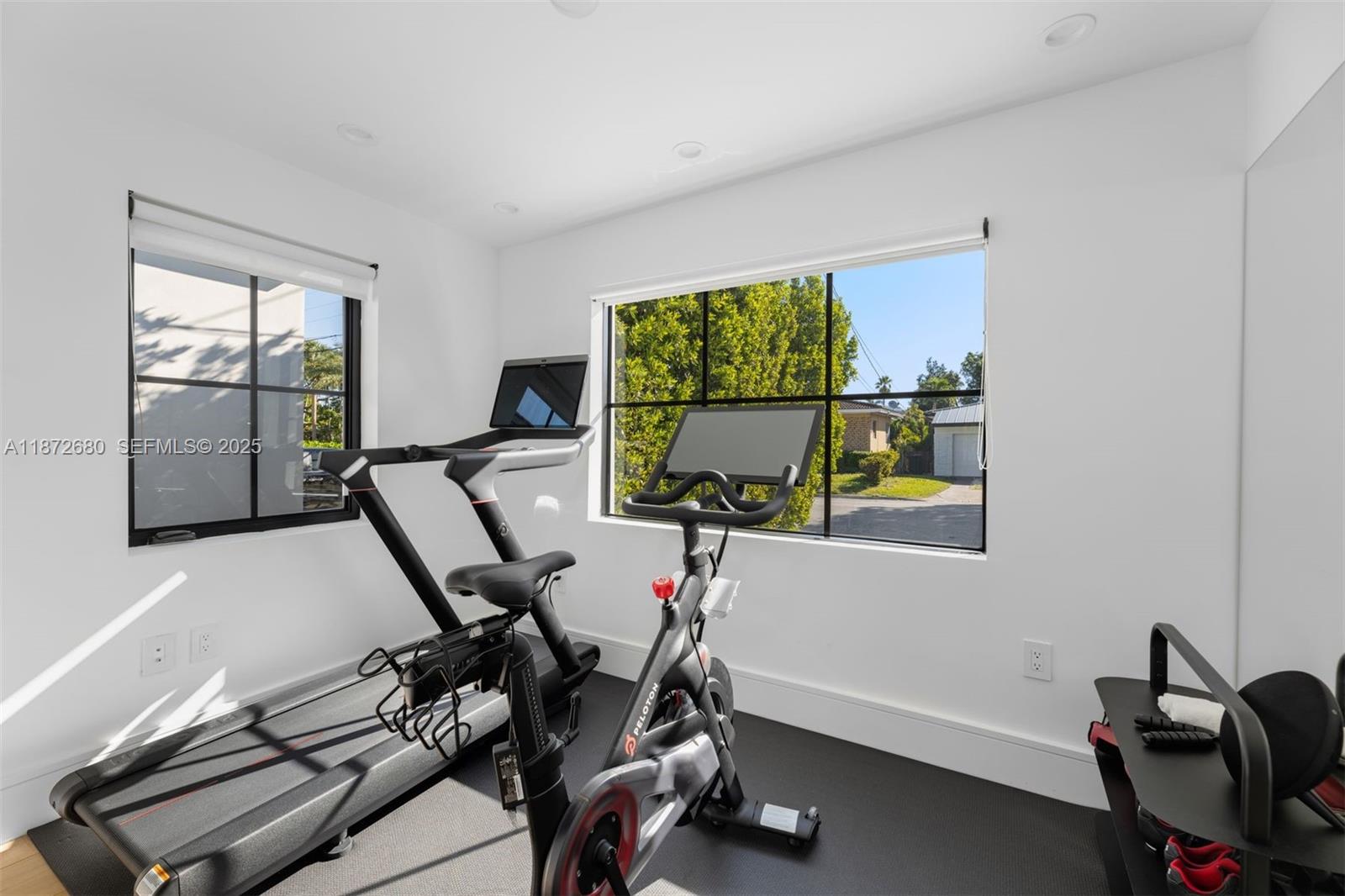 8934 Garland Avenue Surfside, FL 33154 - Photo 14 of 20 a view of a workspace with furniture and a window