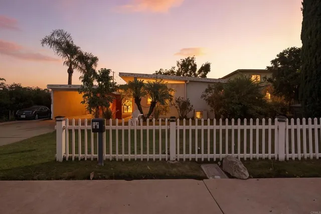 a view of a wrought iron fences in front of house