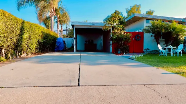 a view of a house with basketball court