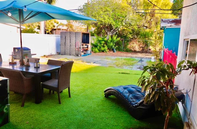 a view of a chairs and table in the patio