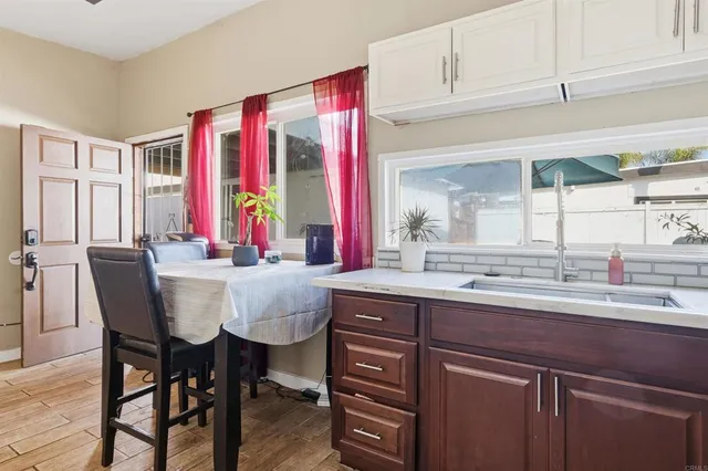 a kitchen with a sink and cabinets