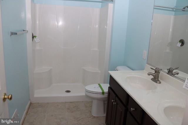3309 Portrait Way Chambersburg, PA 17202 - Photo 11 of 16 a bathroom with a sink a toilet and shower
