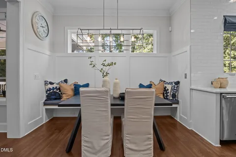 a bathroom with a granite countertop sink a mirror and a shower