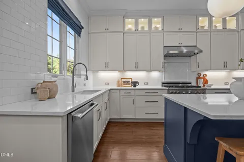 a bedroom with a bed window and a dresser