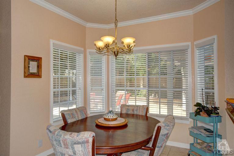 761 Coronado Place Oxnard, CA 93030 - Photo 12 of 27 a view of a dining room with furniture and large windows