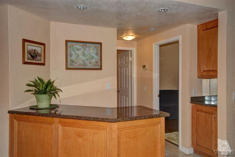 761 Coronado Place Oxnard, CA 93030 - Photo 14 of 27 a kitchen with stainless steel appliances granite countertop sink a refrigerator and a stove