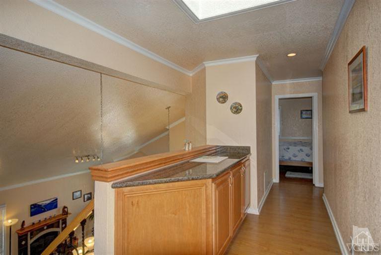 761 Coronado Place Oxnard, CA 93030 - Photo 16 of 27 a kitchen that has a lot of cabinets in it