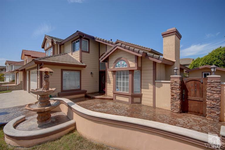 761 Coronado Place Oxnard, CA 93030 - Photo 2 of 27 a front view of a house with garden