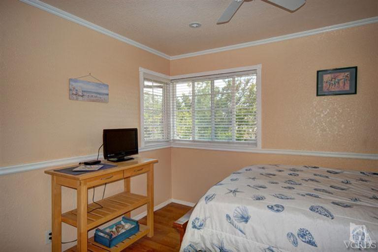 761 Coronado Place Oxnard, CA 93030 - Photo 21 of 27 a bedroom with a bed and a flat screen tv