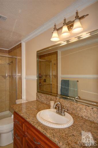 761 Coronado Place Oxnard, CA 93030 - Photo 24 of 27 a bathroom with a sink and a mirror
