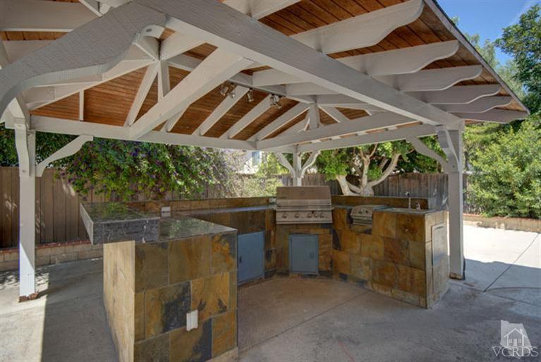 761 Coronado Place Oxnard, CA 93030 - Photo 26 of 27 a view of patio with a table and chairs