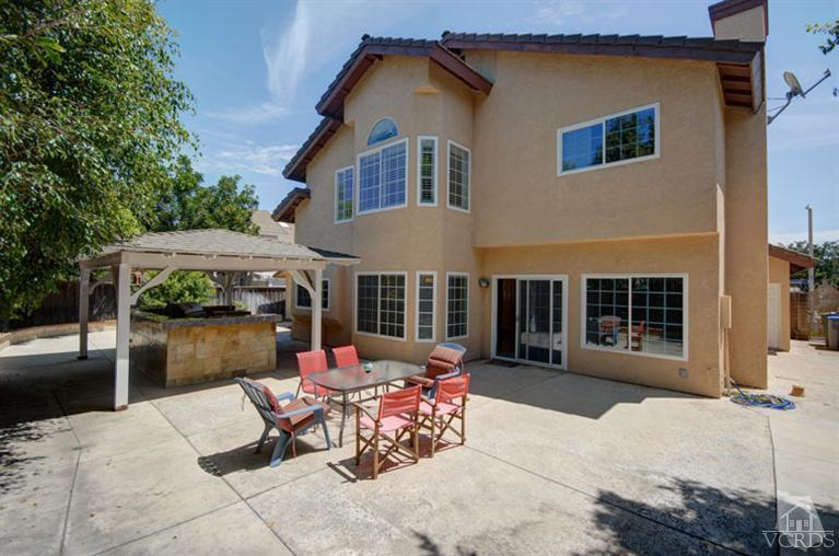761 Coronado Place Oxnard, CA 93030 - Photo 27 of 27 a view of a patio with a table and chairs under an umbrella