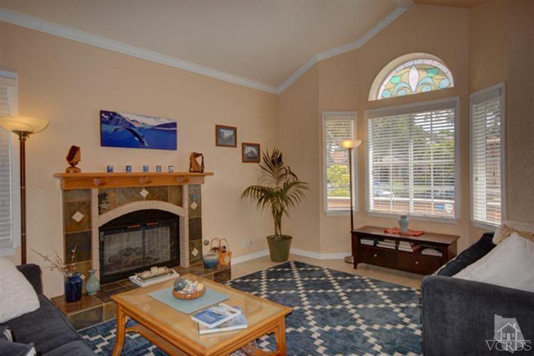 761 Coronado Place Oxnard, CA 93030 - Photo 6 of 27 a living room with furniture a rug and a fireplace