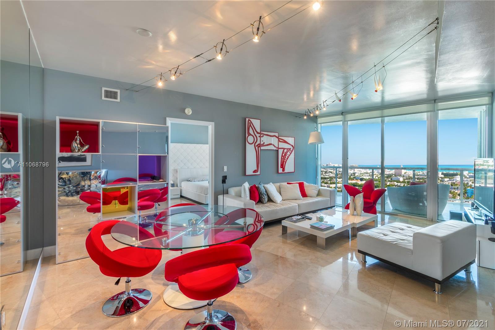 a living room with lots of furniture and air hockey table