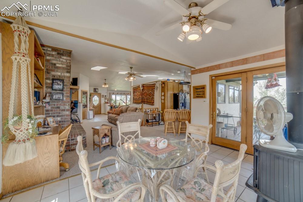 10624 Baxter Road Rye, CO 81069 - Photo 8 of 50 a living room with fireplace furniture and a chandelier