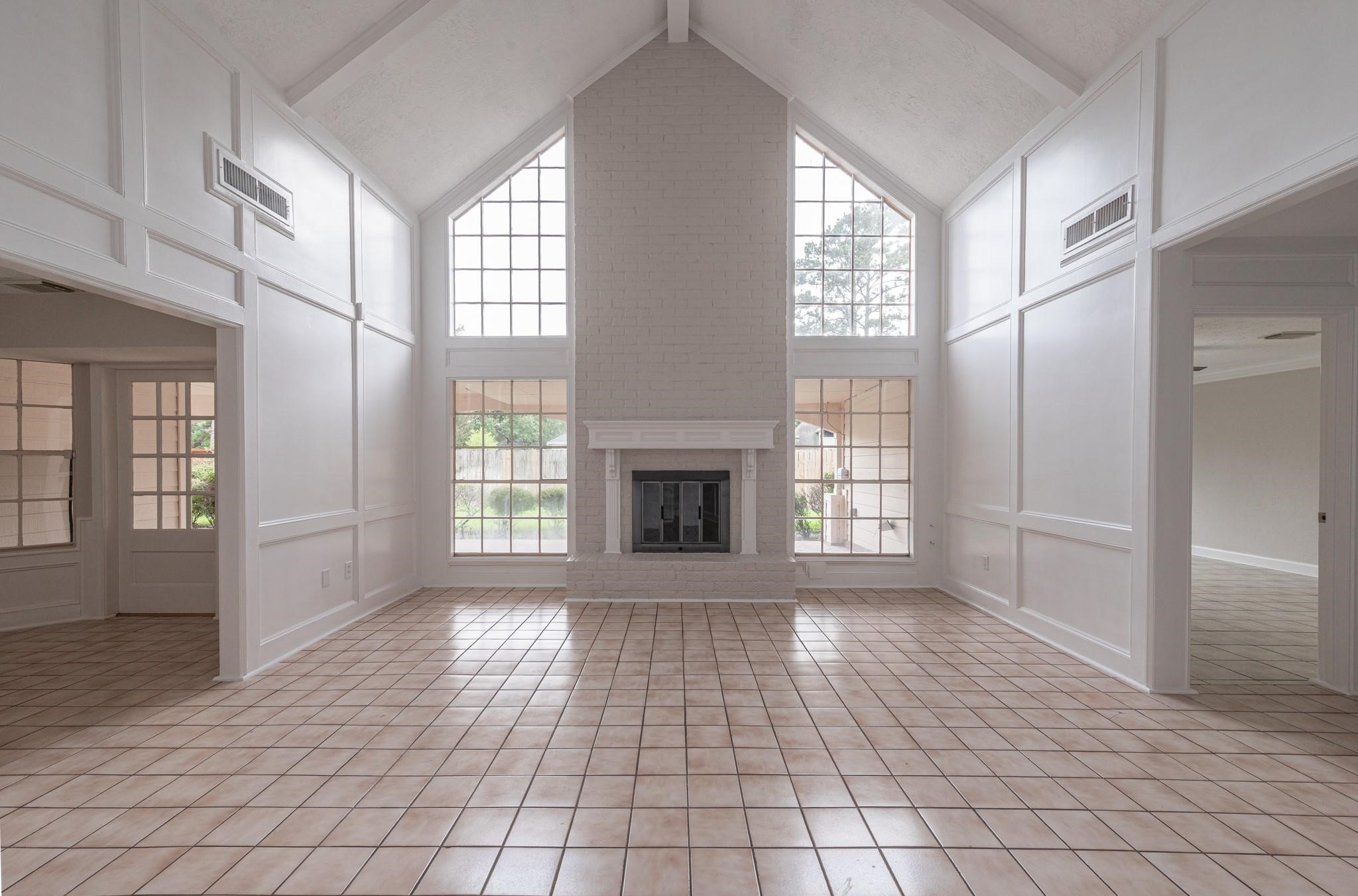 8019 Beaufort Drive Spring, TX 77379 - Photo 19 of 47 a view of an empty room with glass door and windows