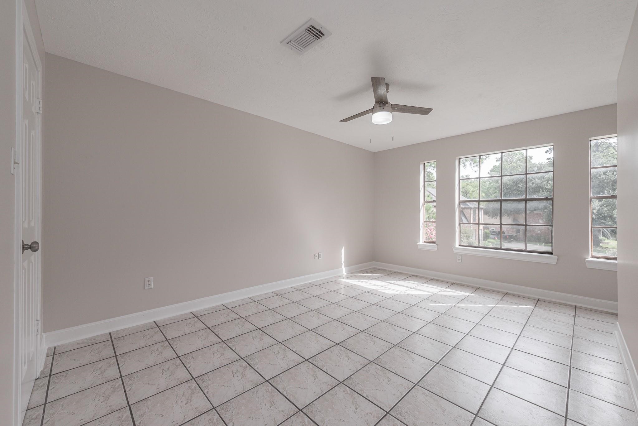 8019 Beaufort Drive Spring, TX 77379 - Photo 31 of 47 a view of an empty room with a window
