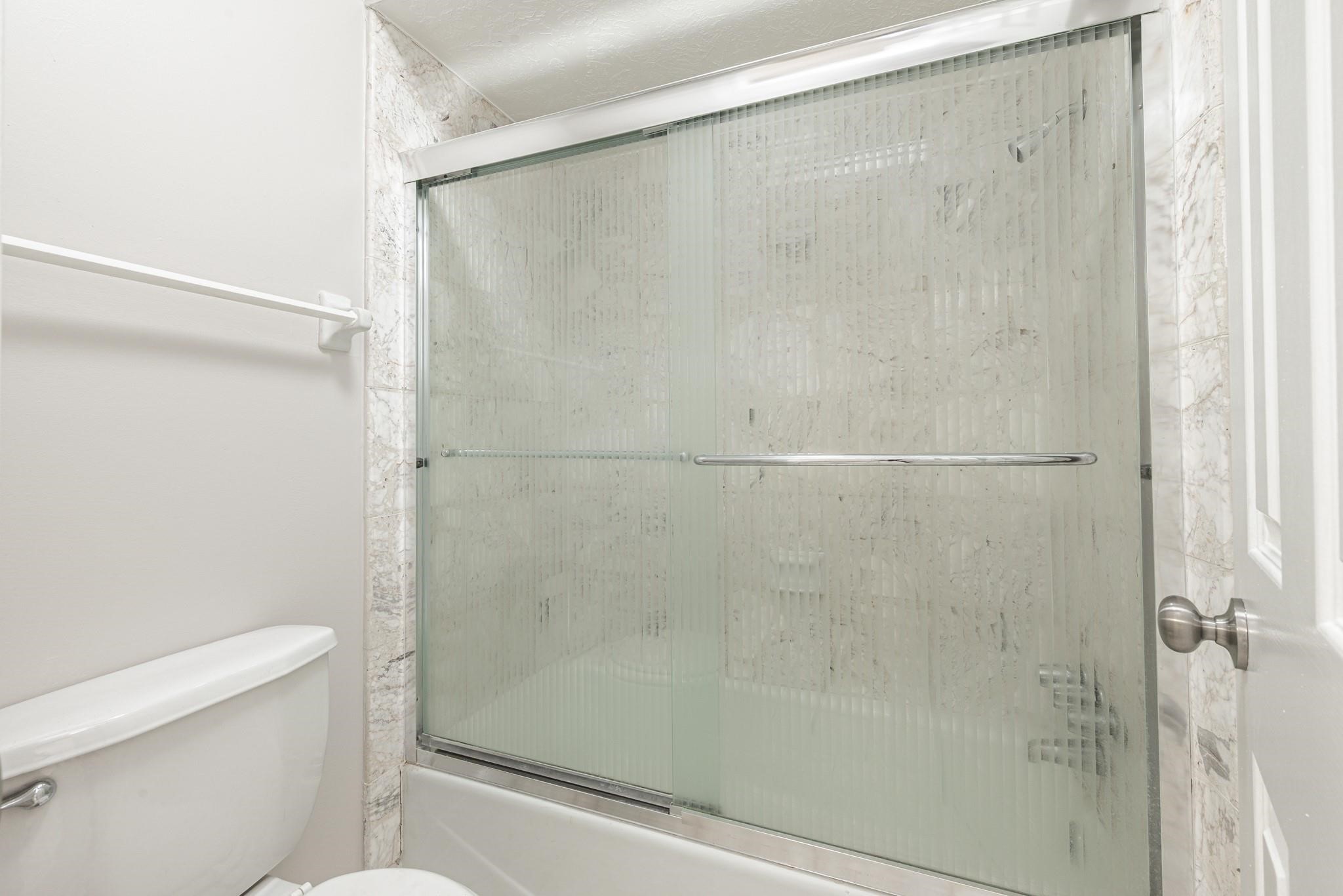 8019 Beaufort Drive Spring, TX 77379 - Photo 34 of 47 a bathroom with a shower and a toilet