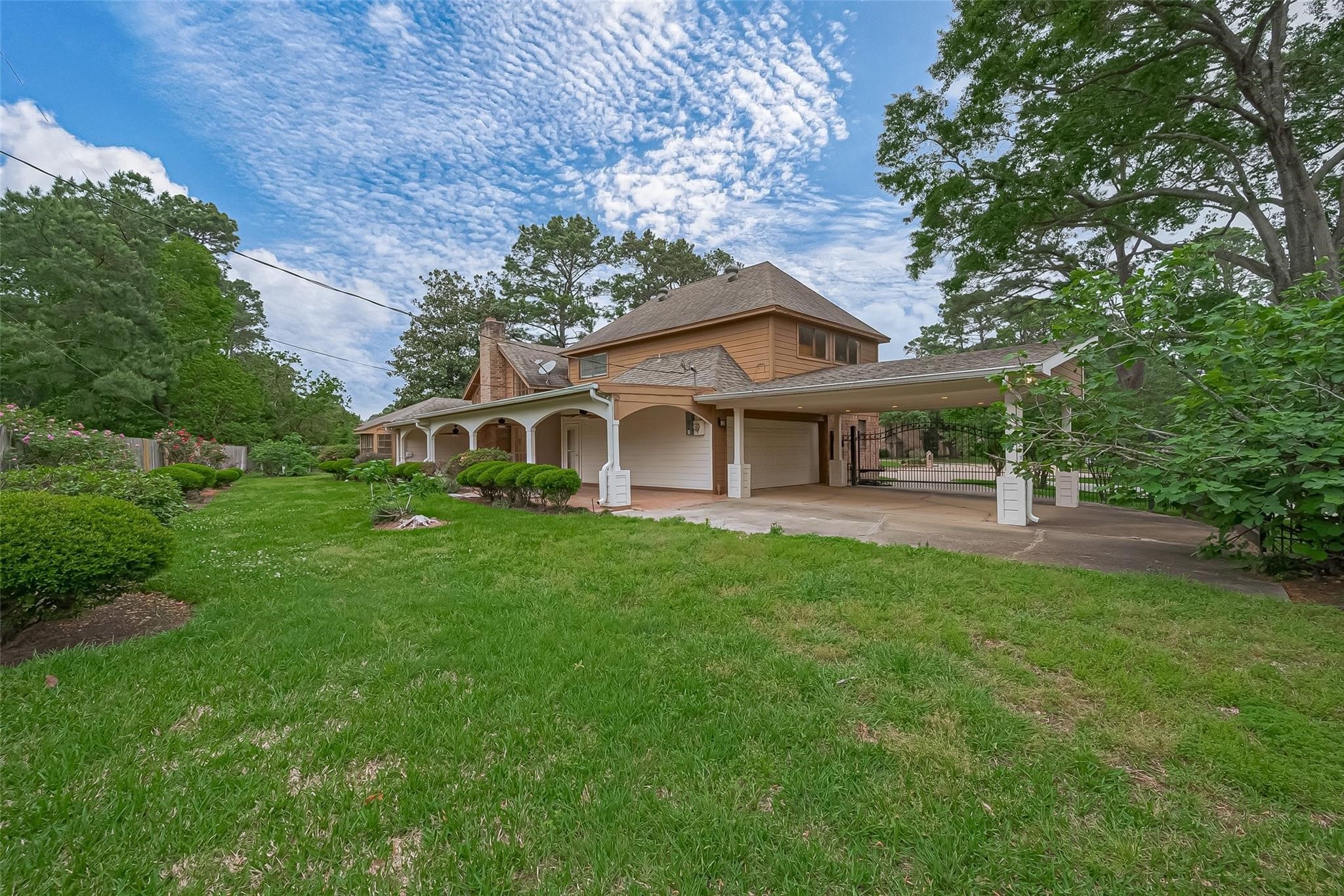 8019 Beaufort Drive Spring, TX 77379 - Photo 46 of 47 a front view of a house with a garden