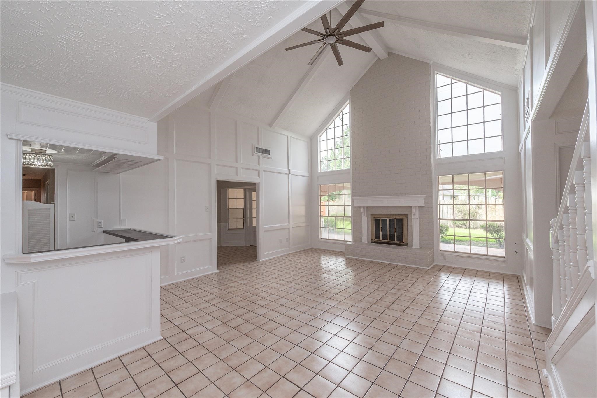 8019 Beaufort Drive Spring, TX 77379 - Photo 9 of 47 a view of a big room with windows and fireplace