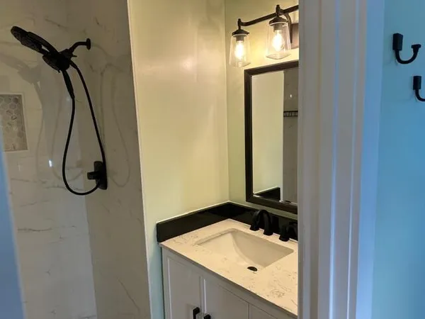 a bathroom with a sink and a mirror