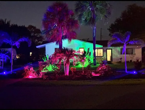 a view of a house with a bunch of flowers