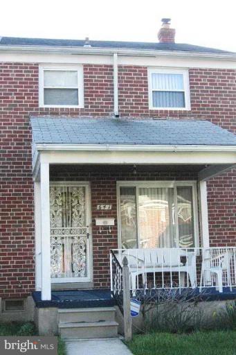 641 Brisbane Road Baltimore, MD 21229 - Photo 1 of 24 a front view of a house with a yard