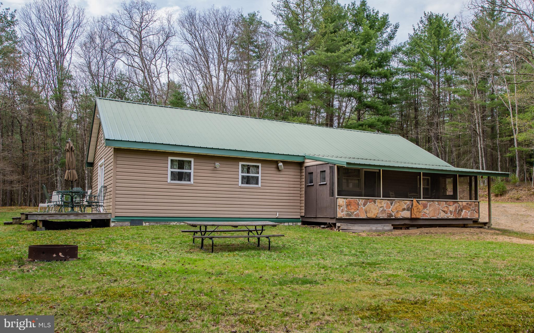 220 Gillens Road Mill Hall, PA 17751 - Photo 1 of 37 a backyard of a house with table and chairs