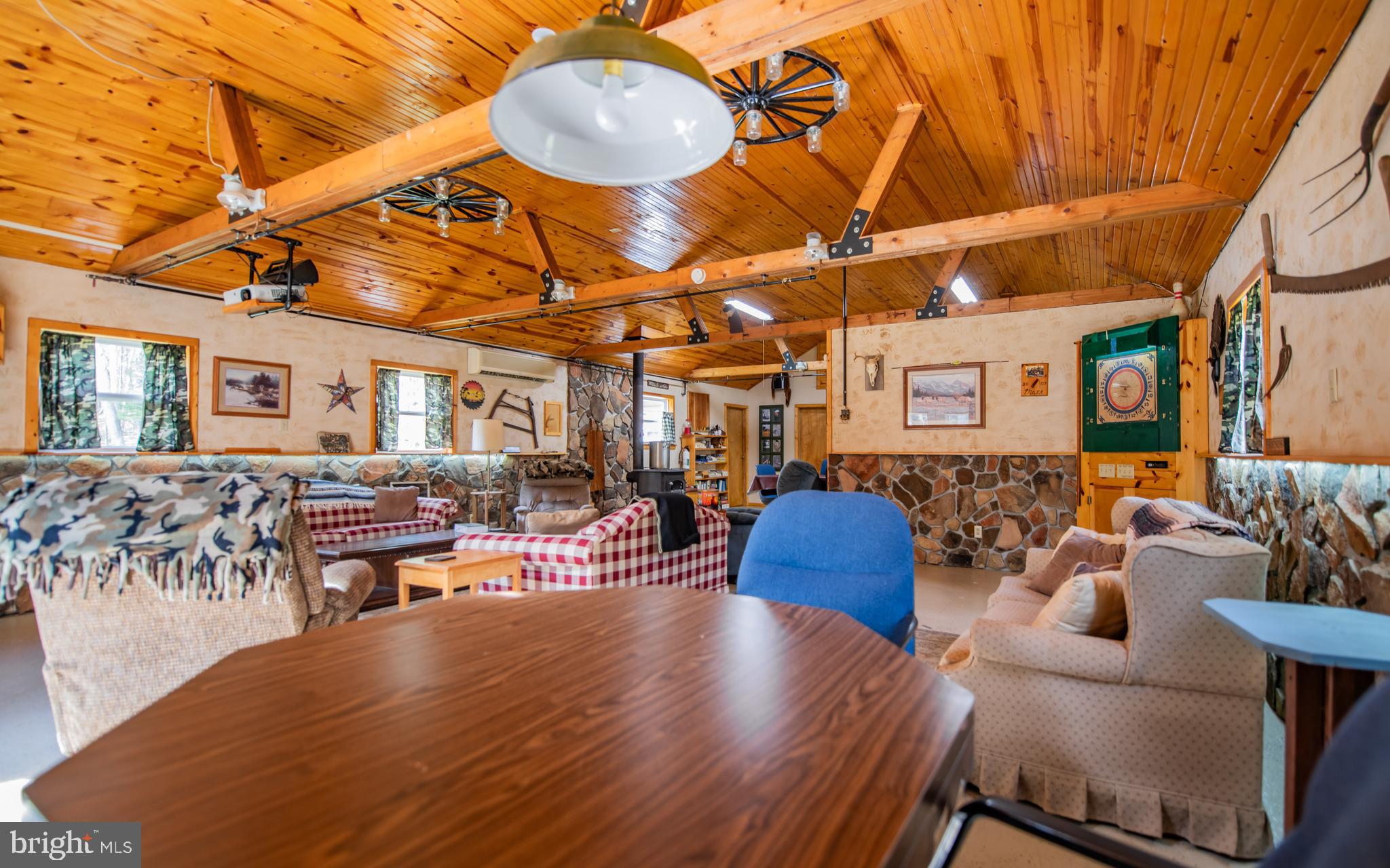 220 Gillens Road Mill Hall, PA 17751 - Photo 11 of 37 a view of a patio with table and chairs with wooden floor