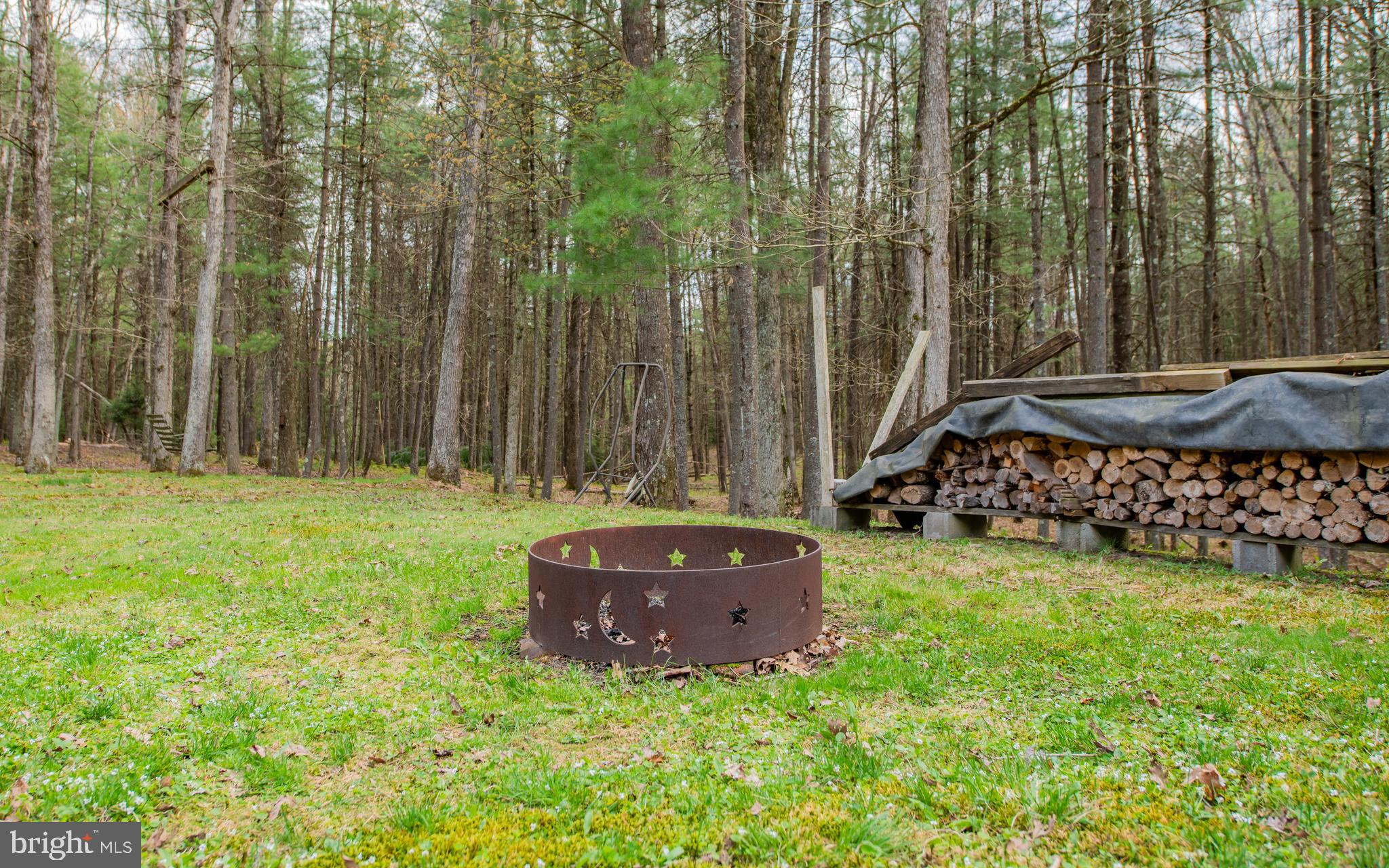 220 Gillens Road Mill Hall, PA 17751 - Photo 25 of 37 a room with trees and a wooden fence