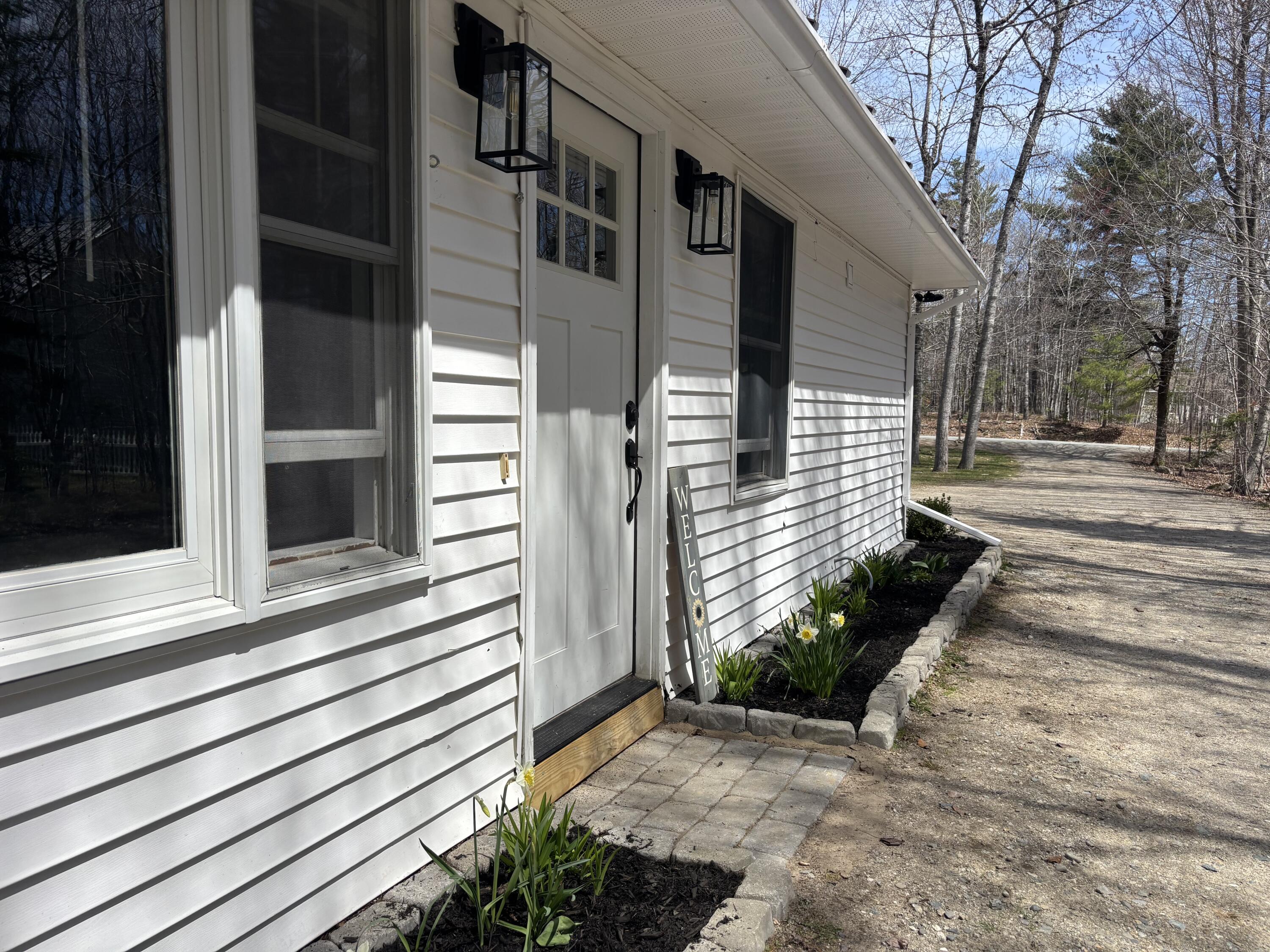 64 Woodland Road Ellsworth, ME 04605 - Photo 1 of 9 Side Entrance