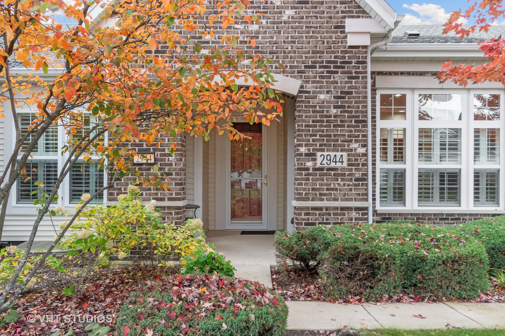 a view of a pathway both side of house