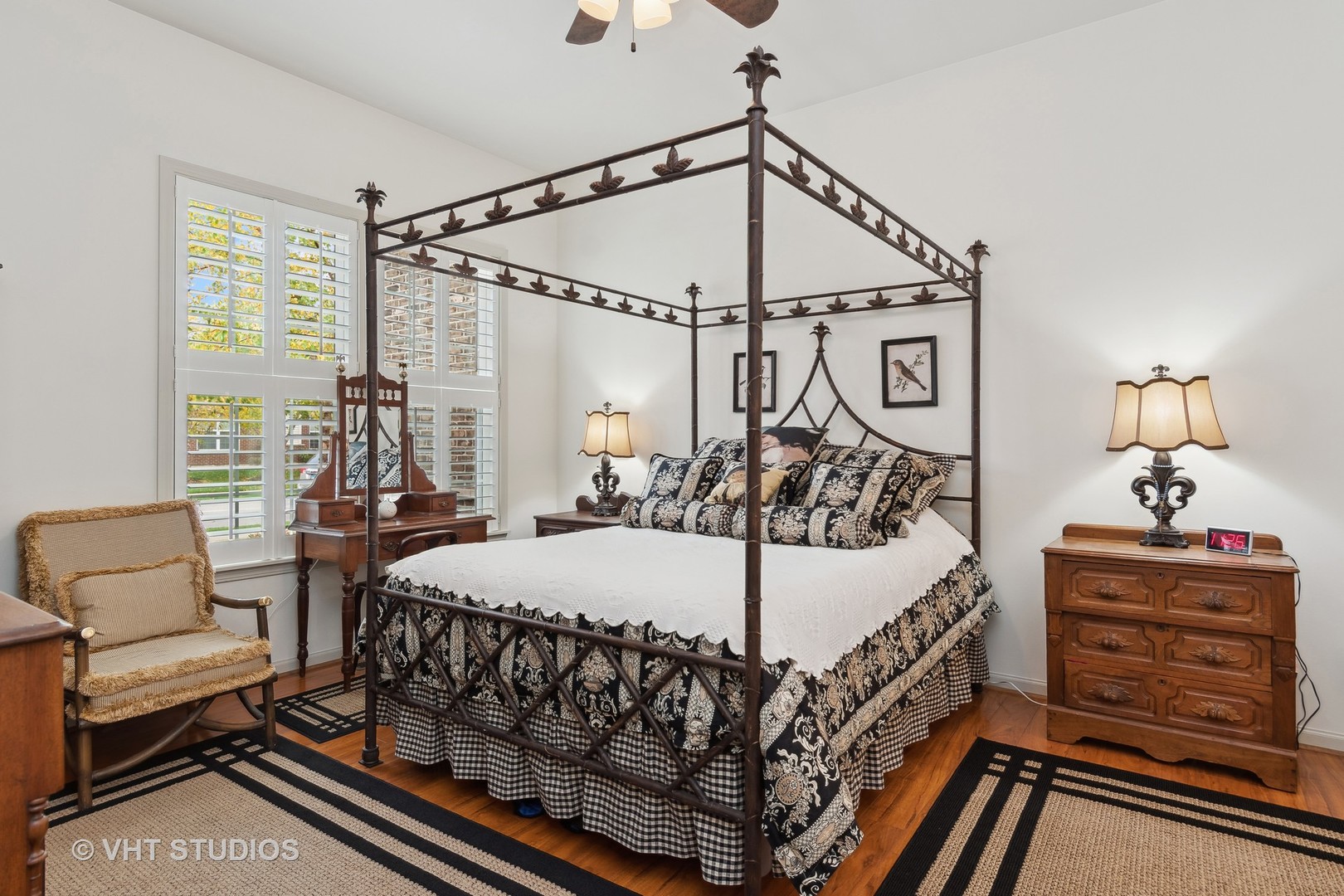 2944 Normandy Circle Naperville, IL 60564 - Photo 12 of 38 a bedroom with a bed a chandelier and dresser