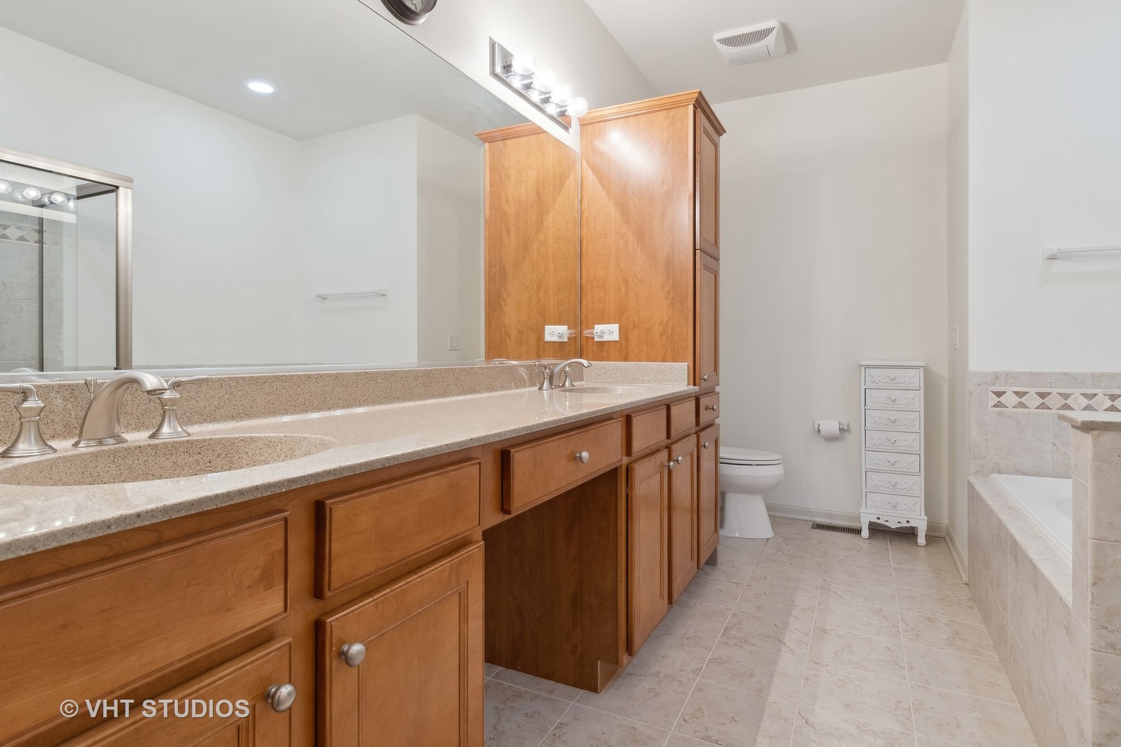 2944 Normandy Circle Naperville, IL 60564 - Photo 13 of 38 a spacious bathroom with a granite countertop sink mirror and toilet