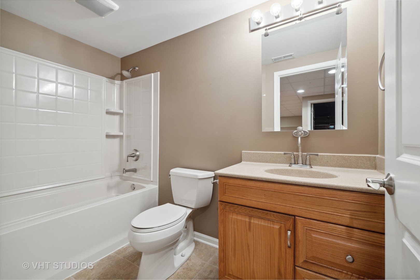 2944 Normandy Circle Naperville, IL 60564 - Photo 19 of 38 a bathroom with a sink a toilet and shower