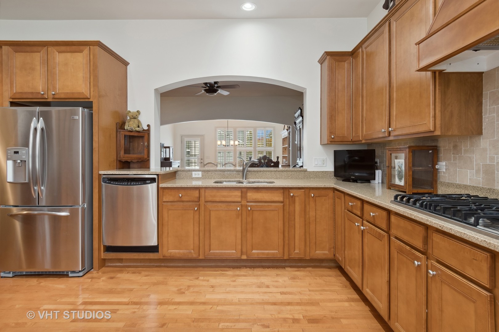 2944 Normandy Circle Naperville, IL 60564 - Photo 4 of 38 a kitchen with stainless steel appliances granite countertop a refrigerator sink and cabinets