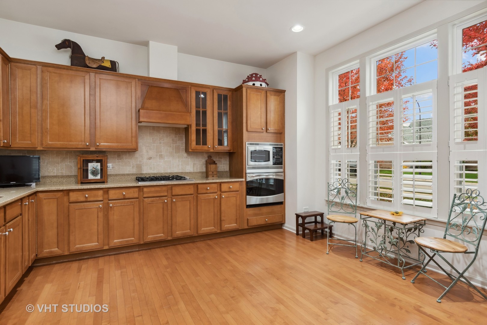 2944 Normandy Circle Naperville, IL 60564 - Photo 6 of 38 a kitchen with stainless steel appliances granite countertop a stove a sink and a refrigerator