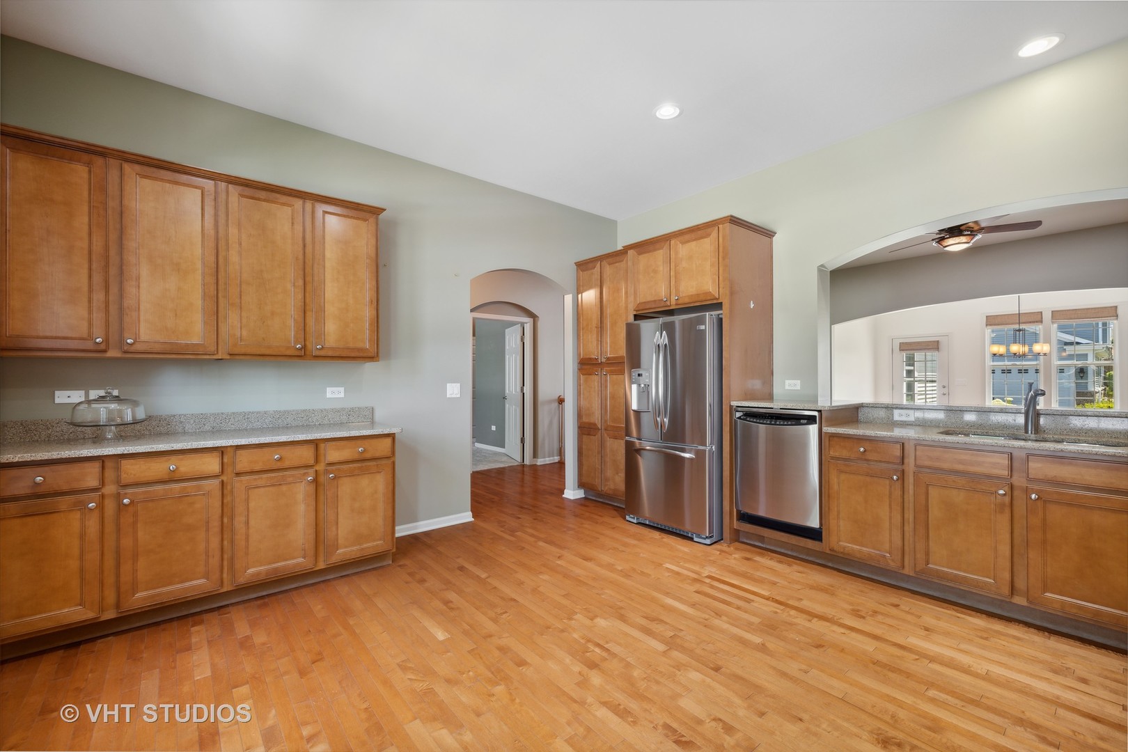 2944 Normandy Circle Naperville, IL 60564 - Photo 7 of 38 a kitchen with stainless steel appliances granite countertop a refrigerator sink and cabinets